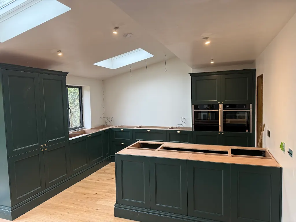 Dark green handmade kitchen with island
